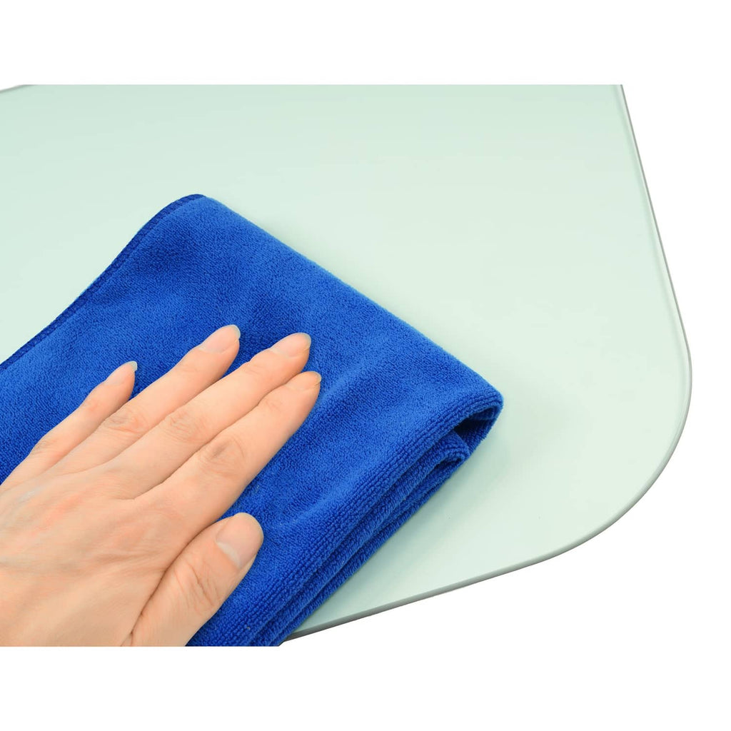 Tinted side glass window panel being wiped with a blue cloth