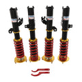 Adjustable coilover strut set with black shocks, red springs, and mounting brackets
