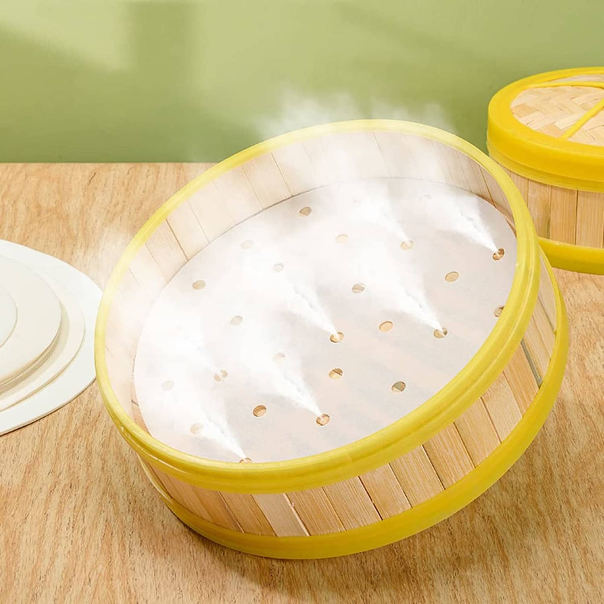 Round white parchment liner with holes inside a yellow air fryer basket