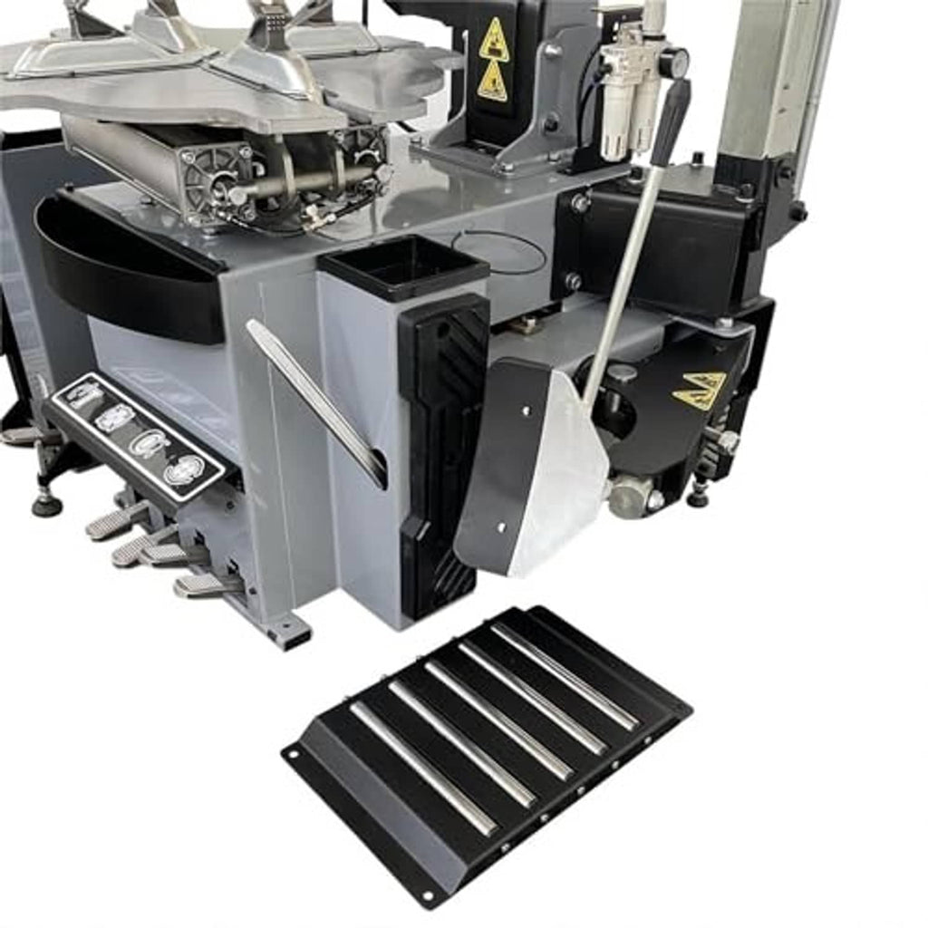 Tire changer base with black slotted ramp and hinged tool housings
