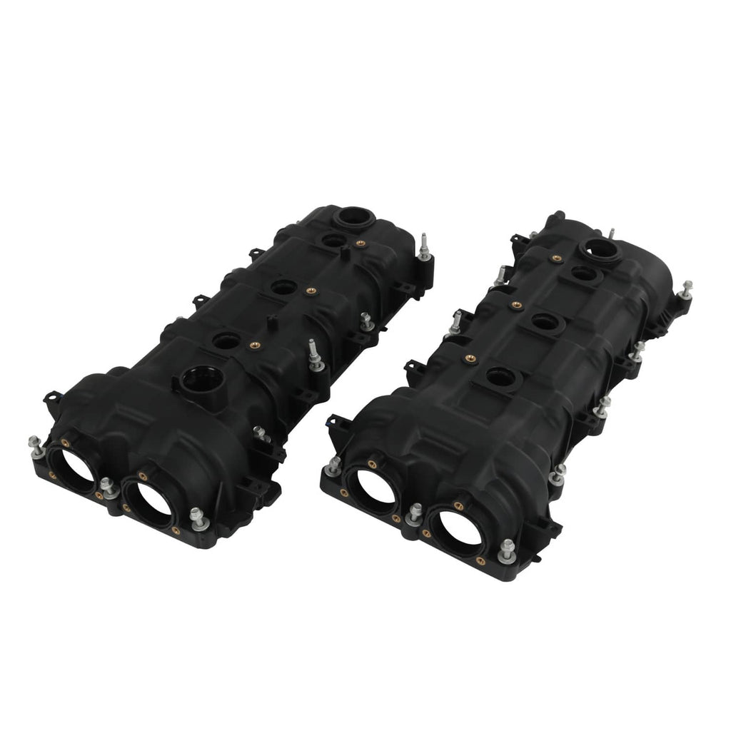 Two black valve covers angled view, circular intake openings and mounting bolts visible.