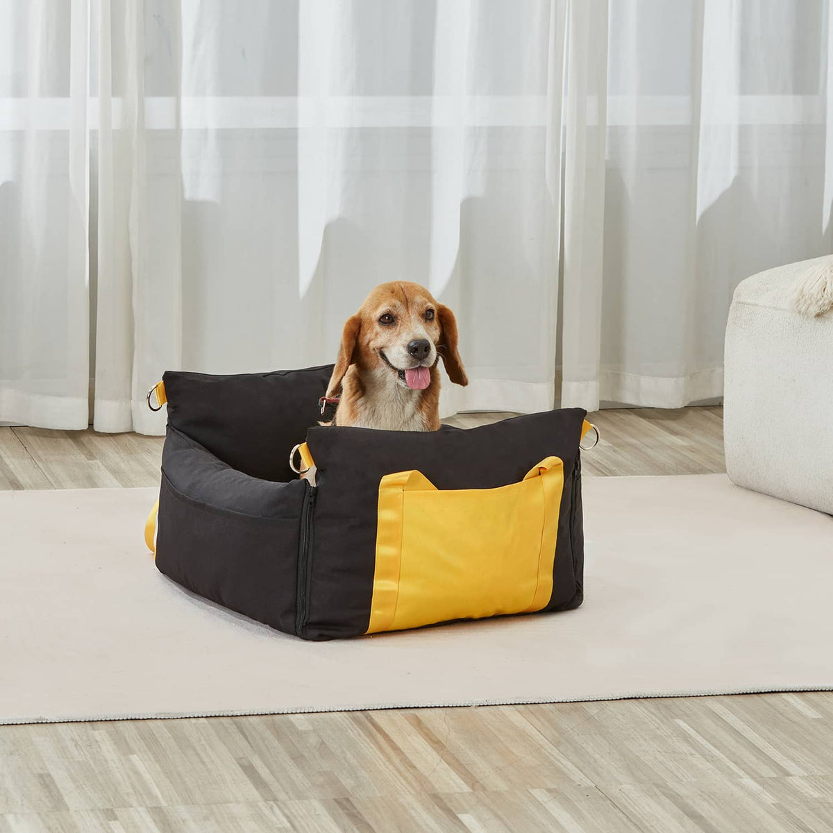 Black and yellow dog booster car seat with plush interior, front opening, and side straps