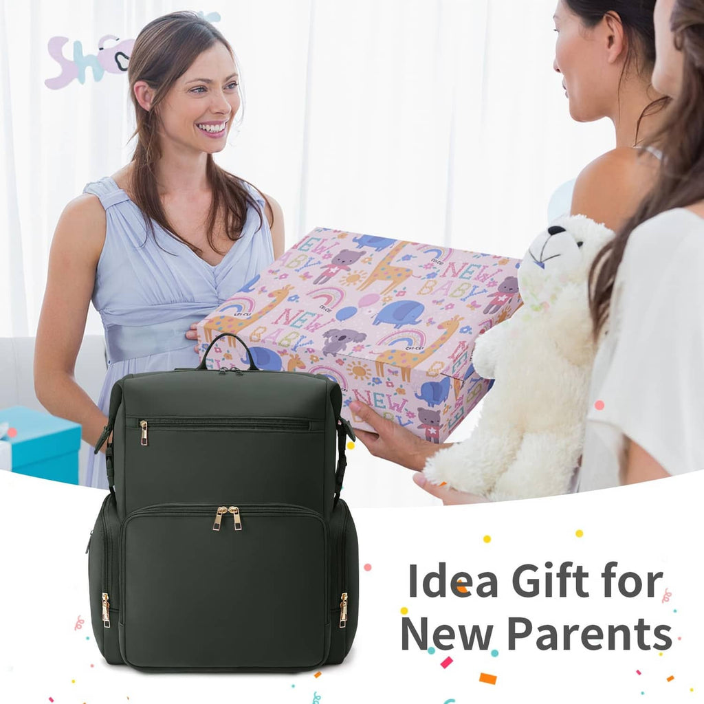 Green diaper bag backpack with zip compartments, shown with wrapped baby gifts and teddy.