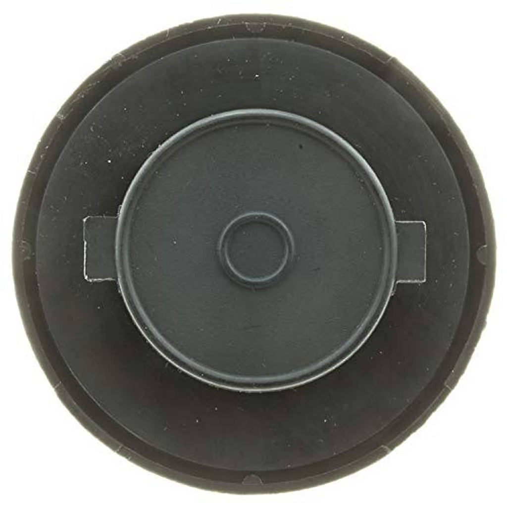 Dark round fuel tank cap with central circle and surrounding locking tabs