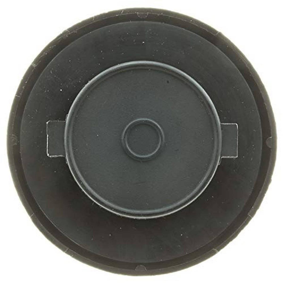 Dark round fuel tank cap with central circle and surrounding locking tabs