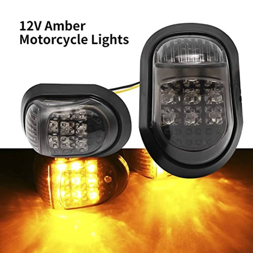 Pair of amber LED motorcycle turn signals lit, in black oval flush-mount housings