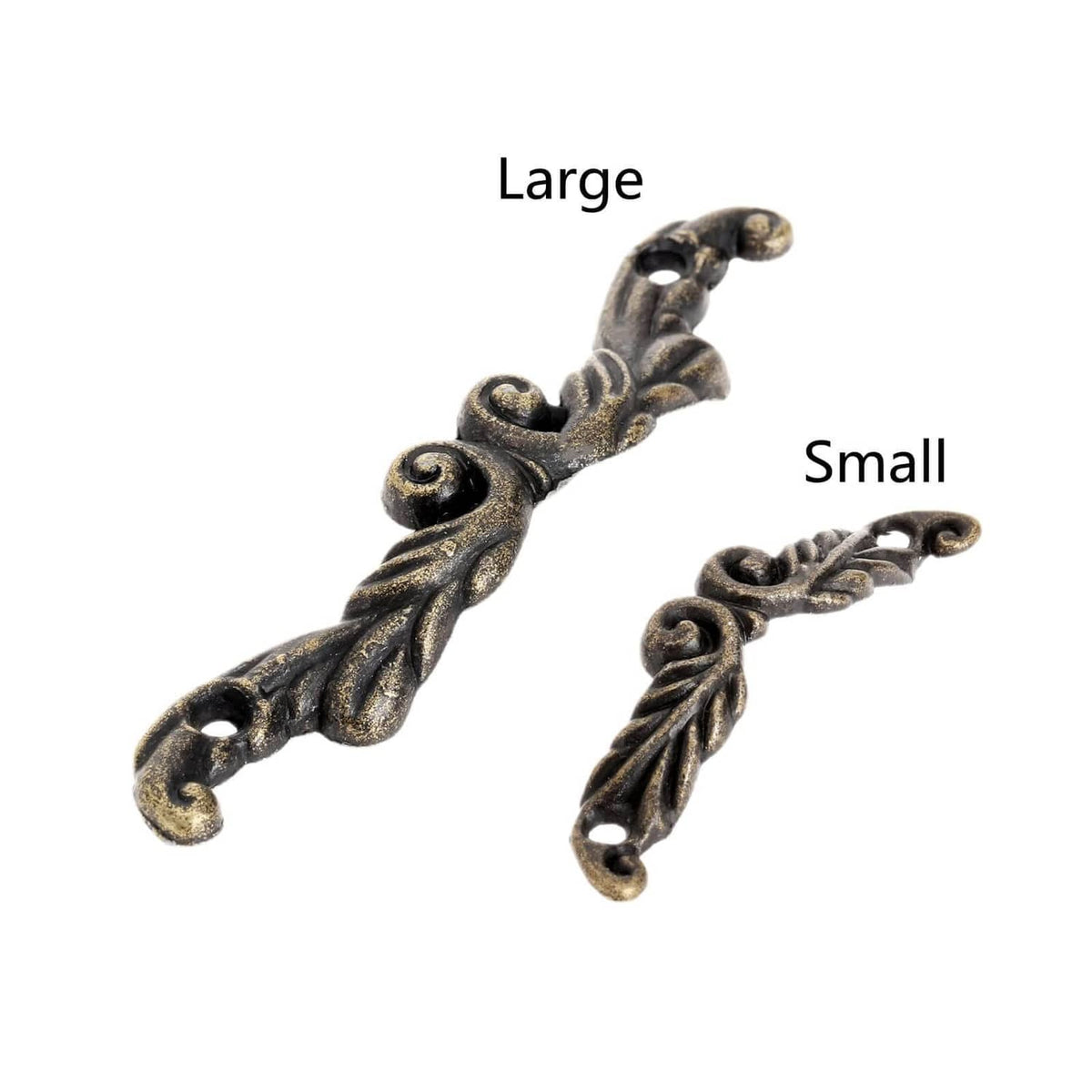 Antique-brass pull handles, one large and one small, ornate scroll details