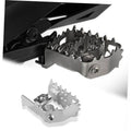 Metal motorcycle footpeg bracket with black serrated insert and mounting bolt