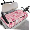 Pink golf cart seat cover towel with golf-themed pattern, black trim, and two seat sections