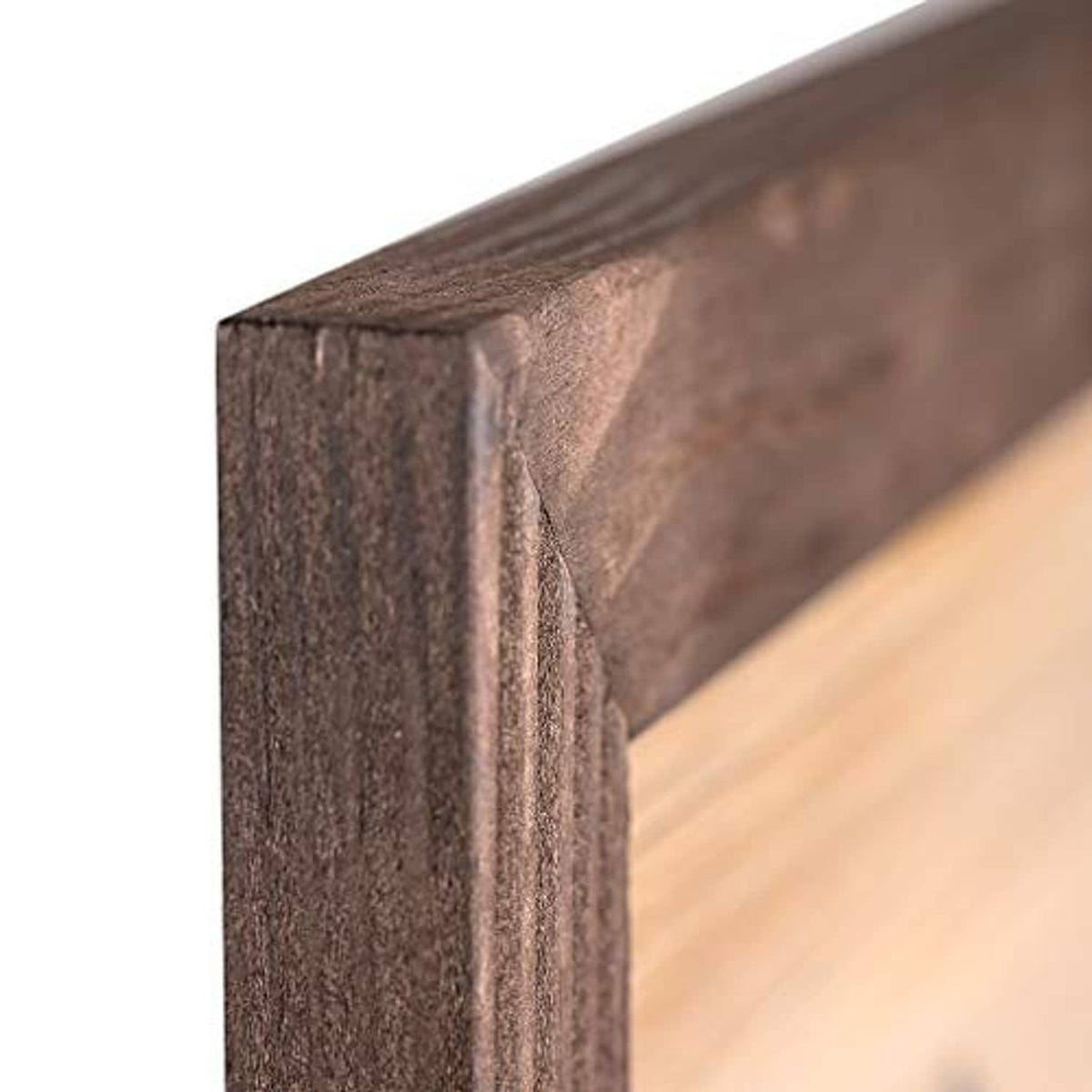 Close-up of dark brown wooden picture frame edge with textured grain