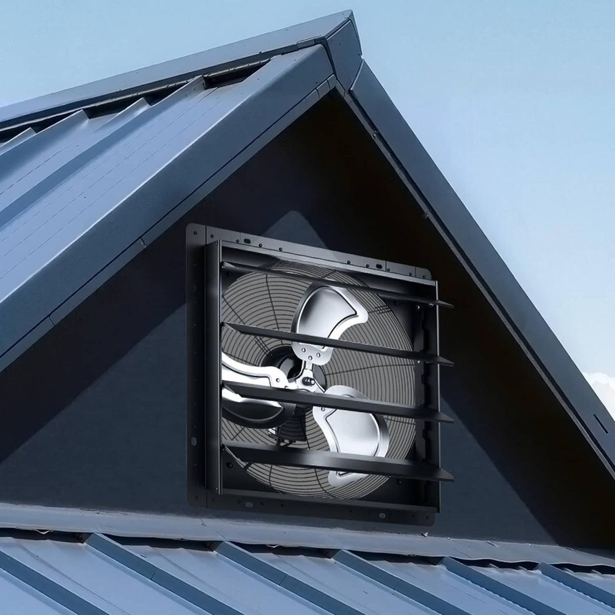 Wall-mount shutter exhaust fan installed under a roof with louvered front grille
