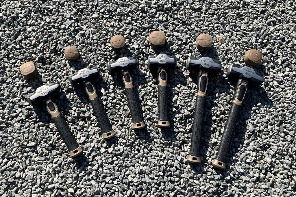 Set of blacksmith hammers with dark handles and light head markings