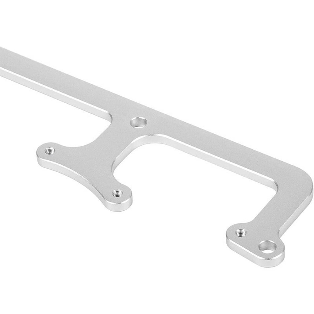 Close-up billet aluminum coil bracket with threaded mounting points and cutouts