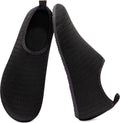 Pair of black water sock shoes with ribbed fabric upper and open heel tab