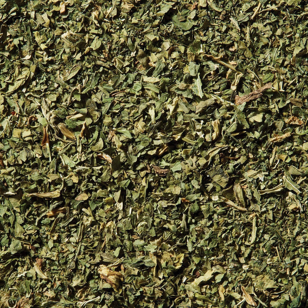 Pile of dried green celery flakes seasoning