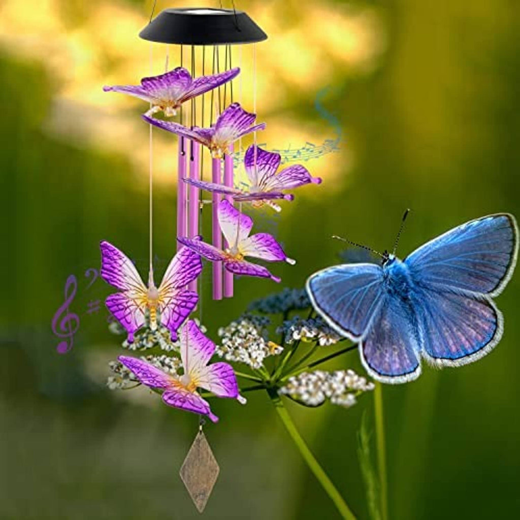 Butterfly solar wind chimes with glowing purple butterflies on a pink frame