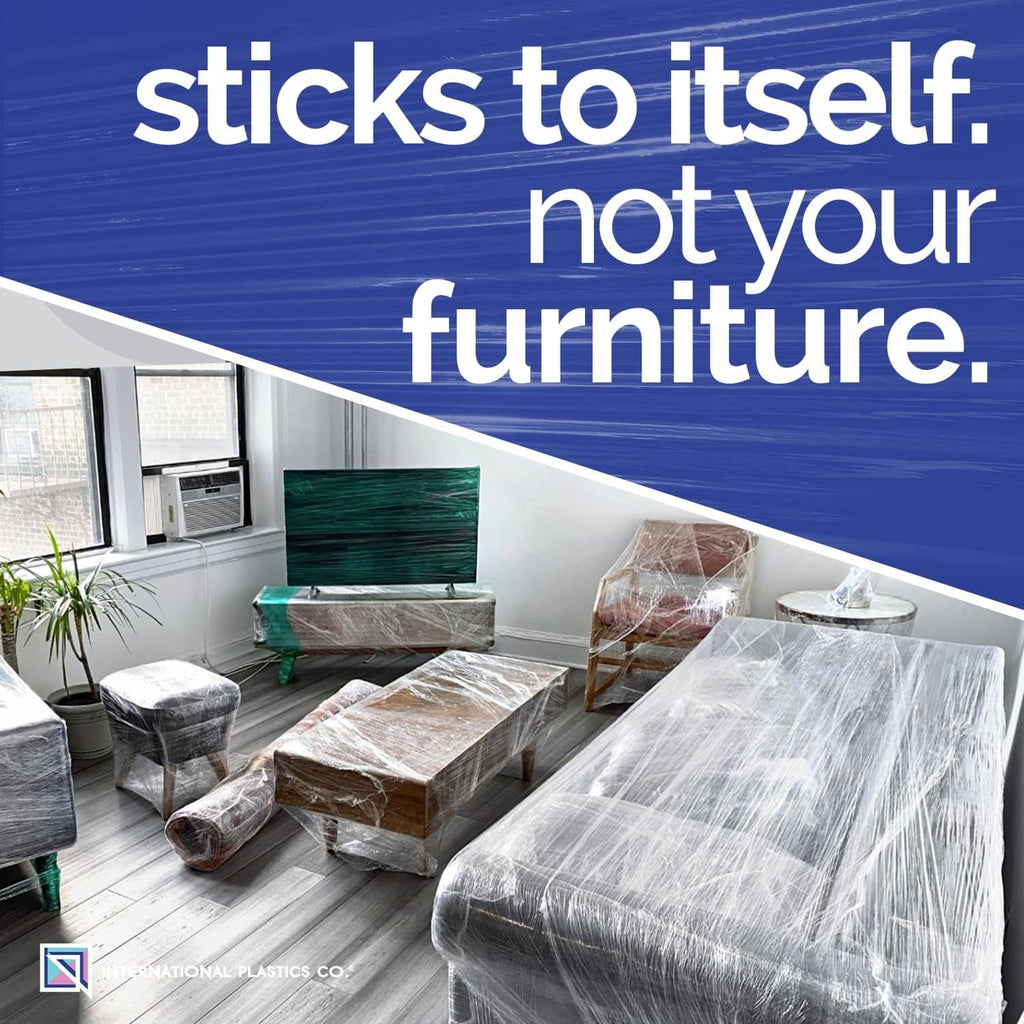 Clear plastic stretch film wrapped furniture and packages on the floor