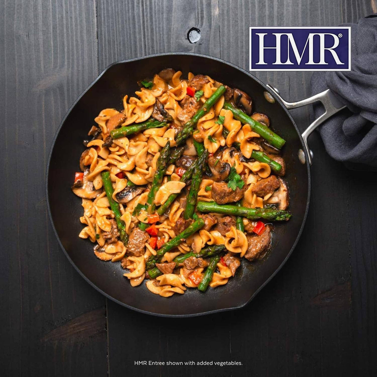 Beef stroganoff noodles with vegetables cooked in a skillet