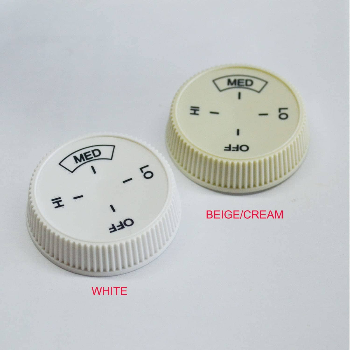 Pair of baseboard heater thermostat dial knobs in white and beige/cream colors