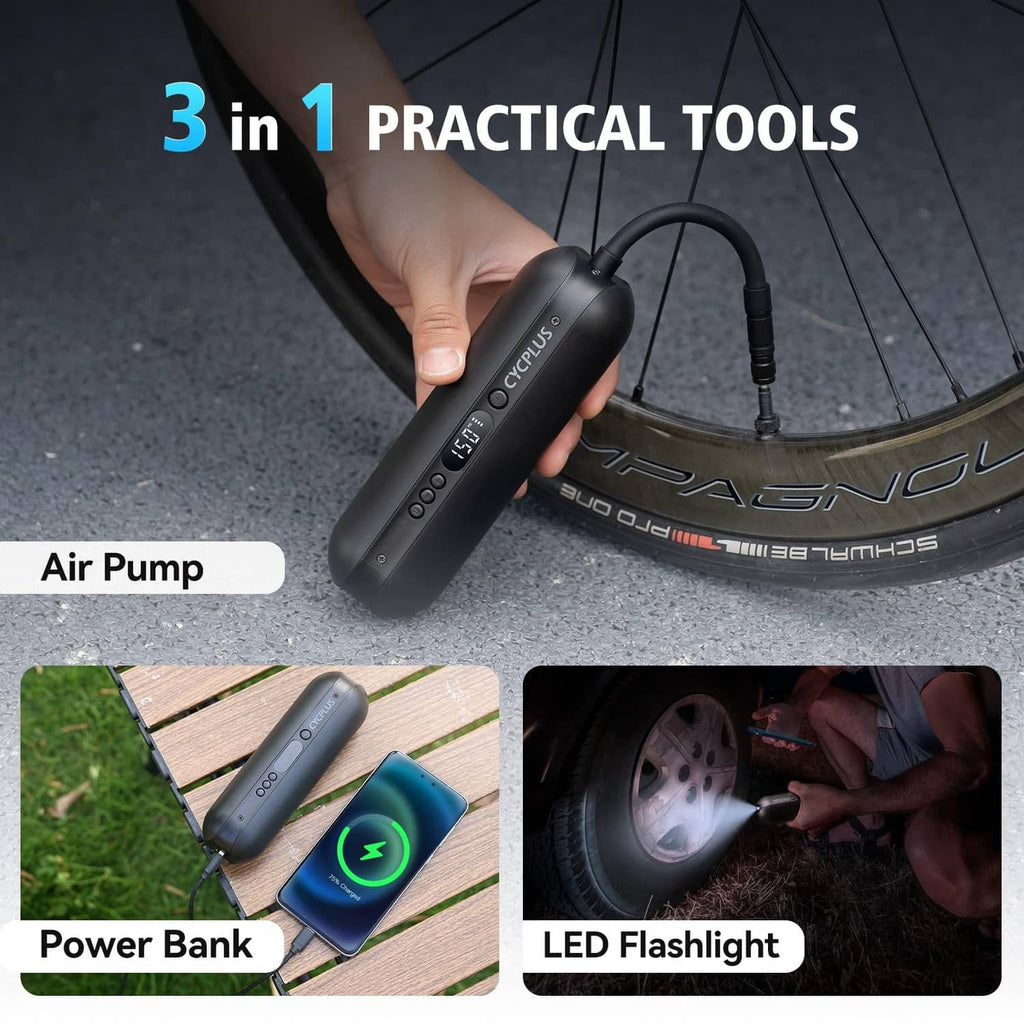 Black portable electric bike air pump being pressed by hand near the valve