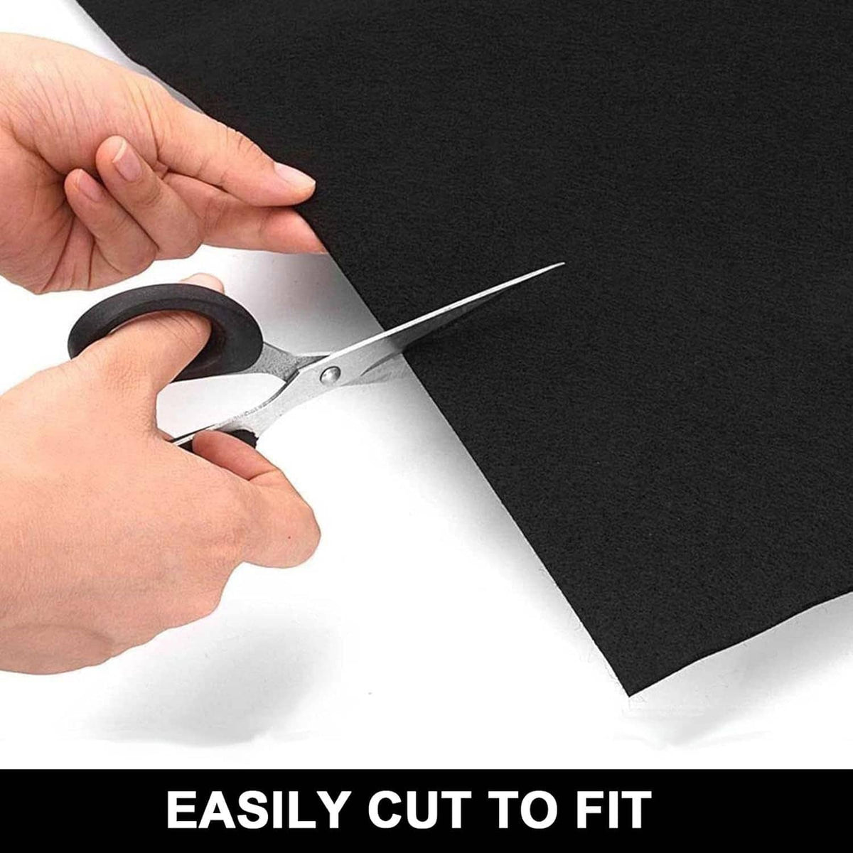 Black oil spill mat cut with scissors for custom size