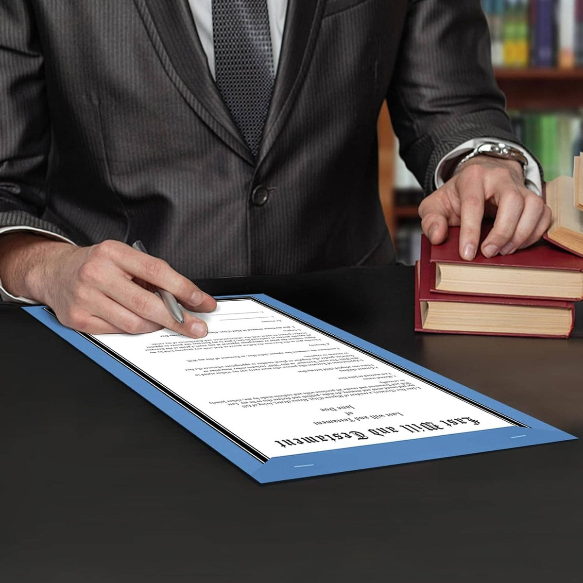 Blue manuscript cover paper with a signed legal document on a desk