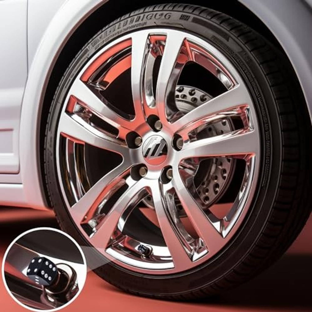 Dice-style tire valve stem cap with black body and silver dot pattern
