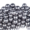 Chrome steel bearing balls, shiny dark-silver spheres in bulk