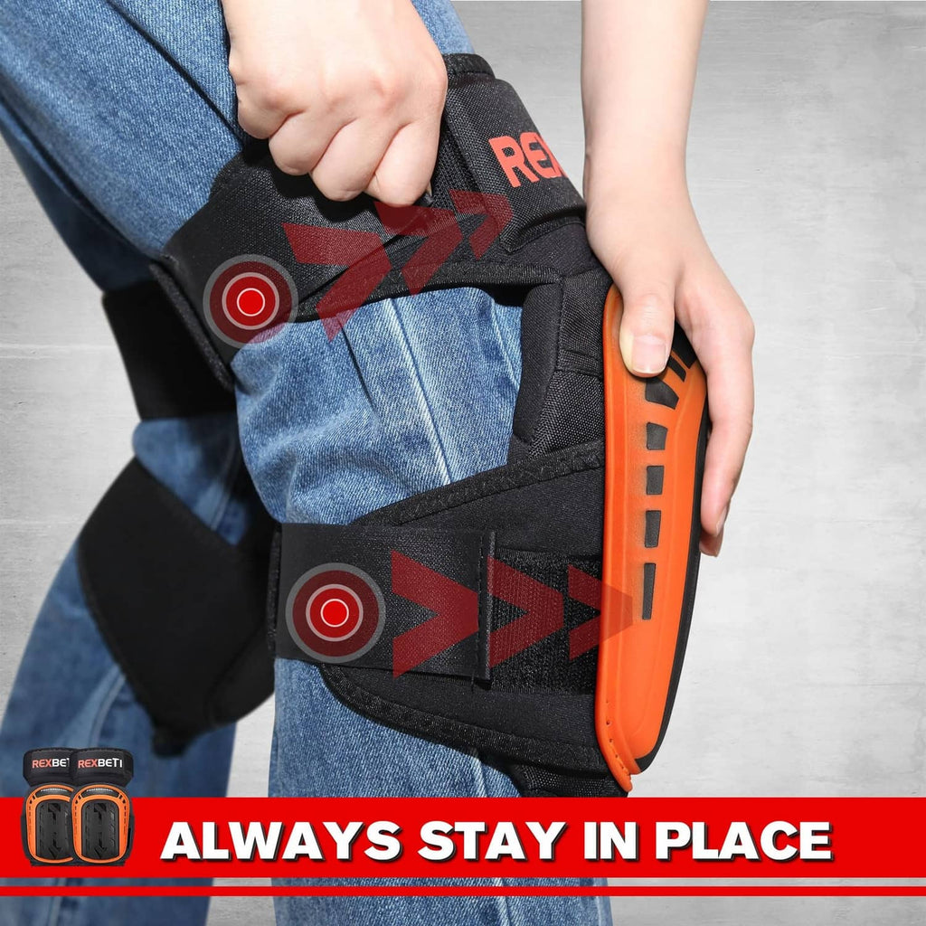 Black knee pad with orange side shell, fastened strap, and padded back for secure fit