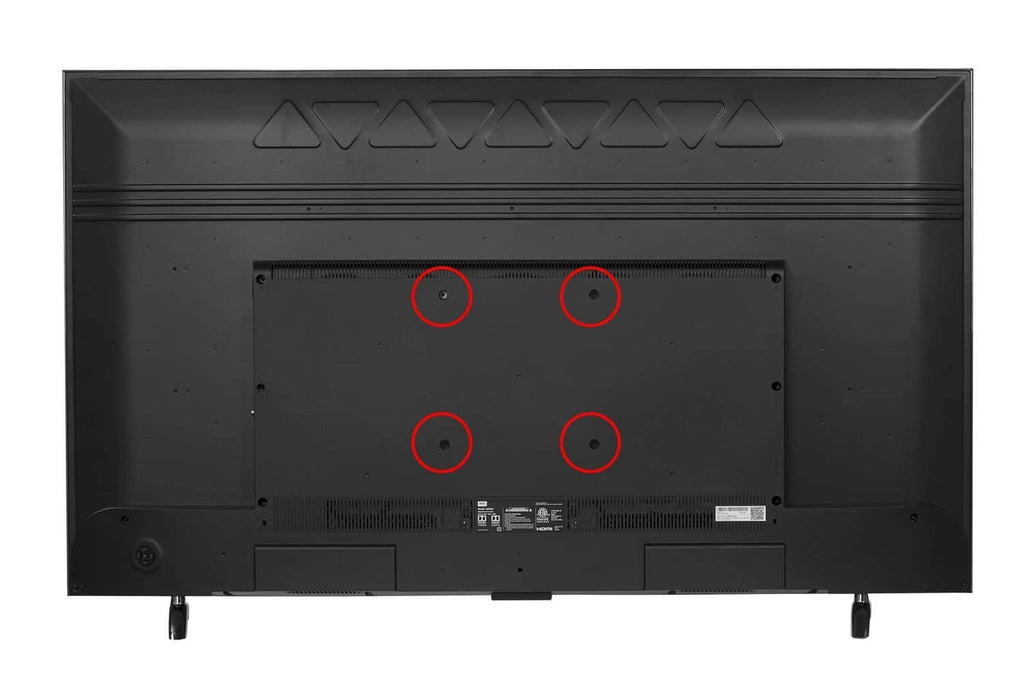 TV back panel with four marked screw holes for mounting bolt hardware