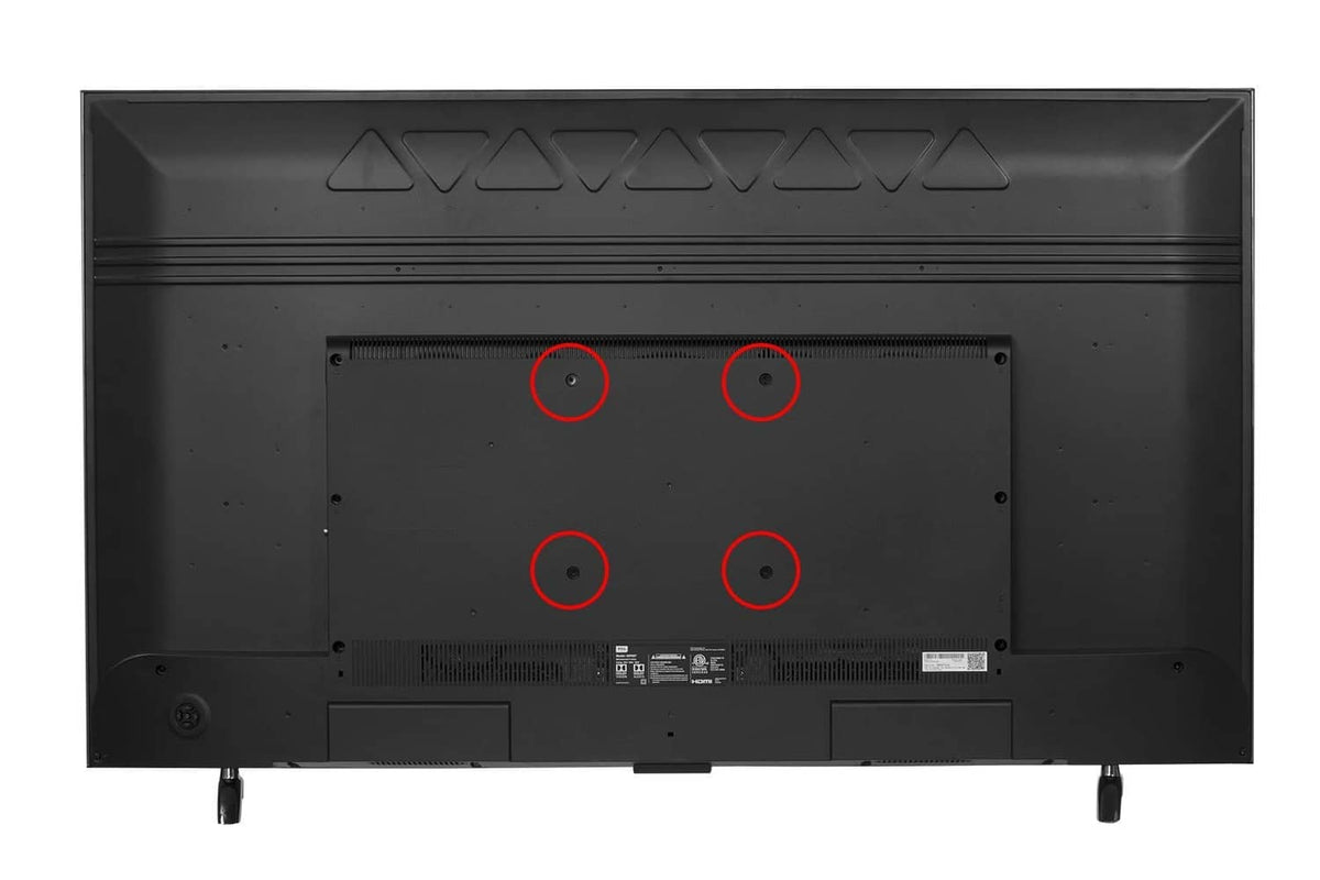 TV back panel with four marked screw holes for mounting bolt hardware
