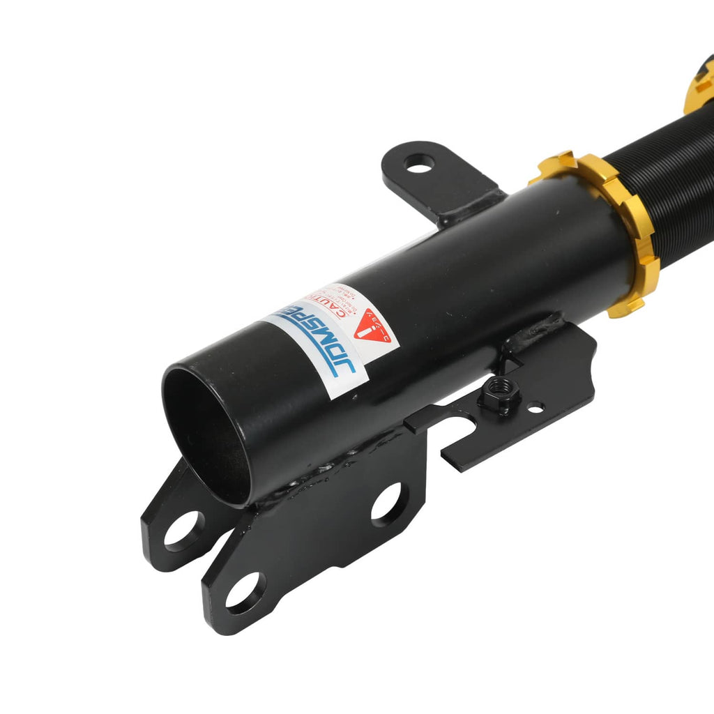Black coilover suspension strut with red spring and gold height adjust collar