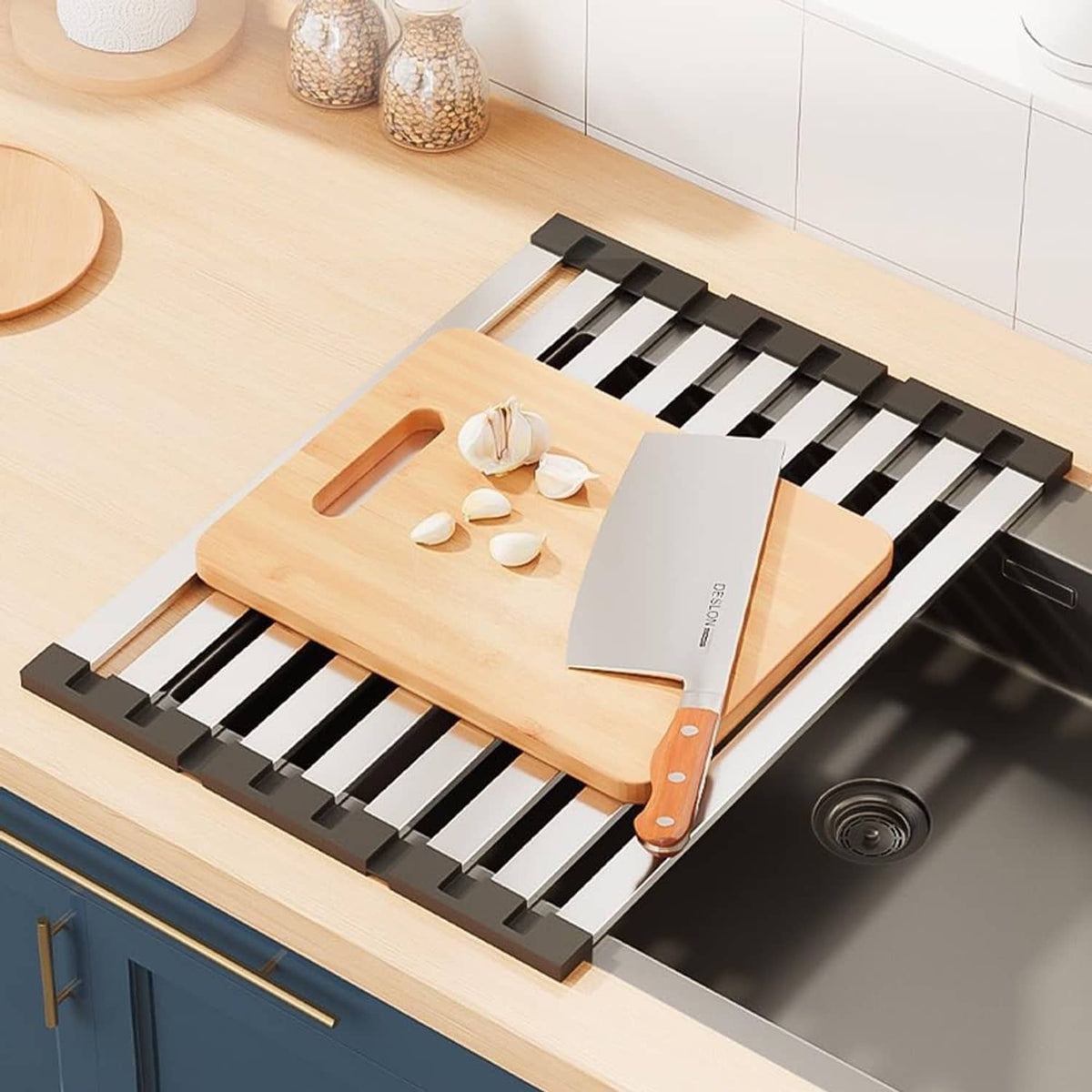 Folded roll-up dish rack with black slat supports holding cookware and utensils