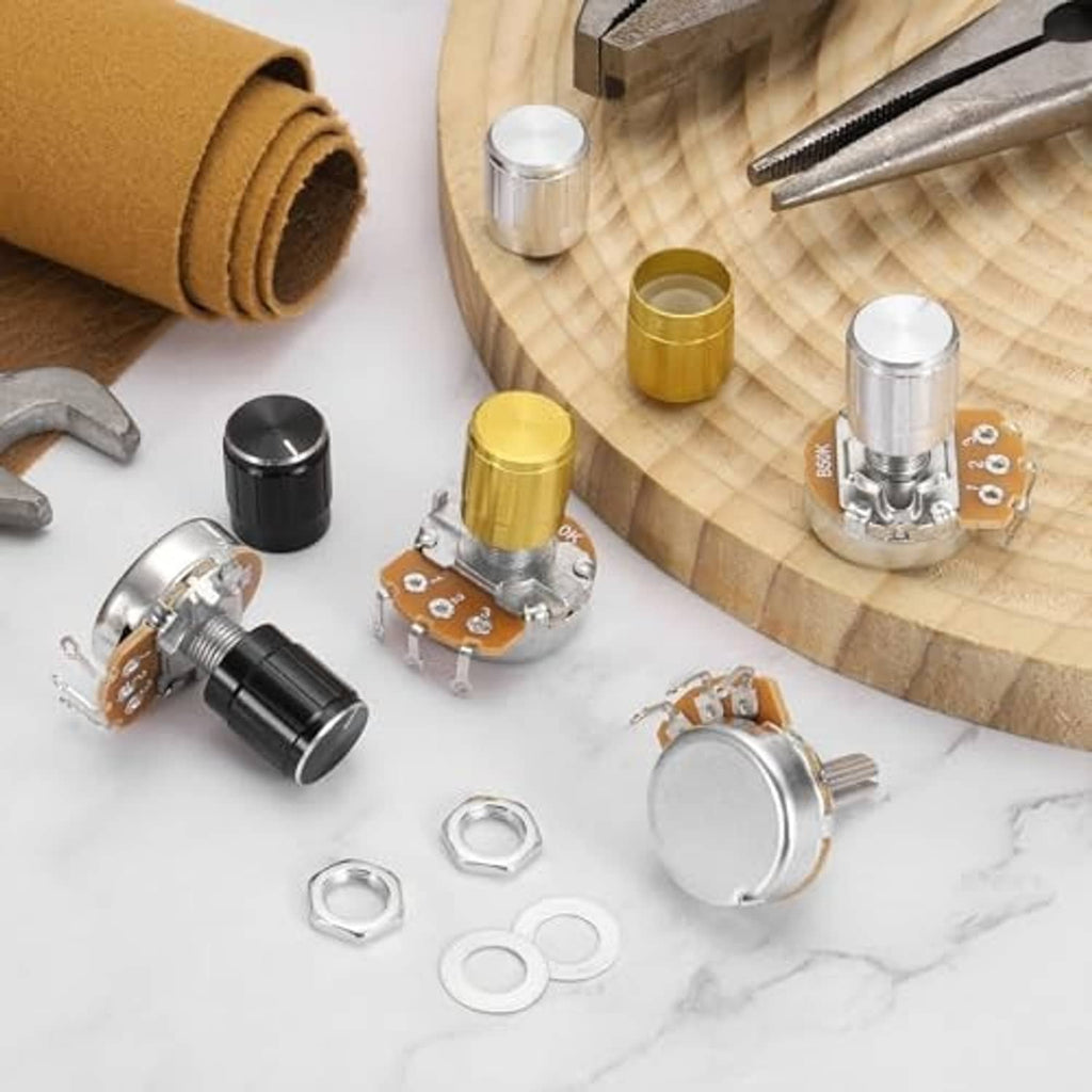 Rotary potentiometer components with silver metal body, orange PCB, and mounting washers