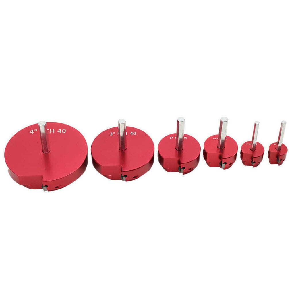 Set of red pipe reamer heads with exposed steel guide rods