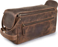 Brown full-grain leather toiletry bag with curved top flap and two zip compartments