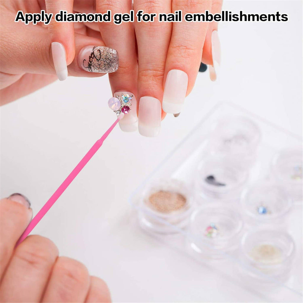 Hand holding a pink micro cotton swab applying gel for nail embellishments
