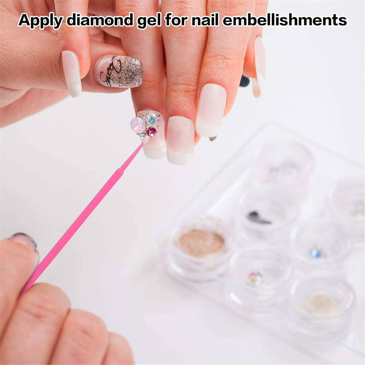 Hand holding a pink micro cotton swab applying gel for nail embellishments