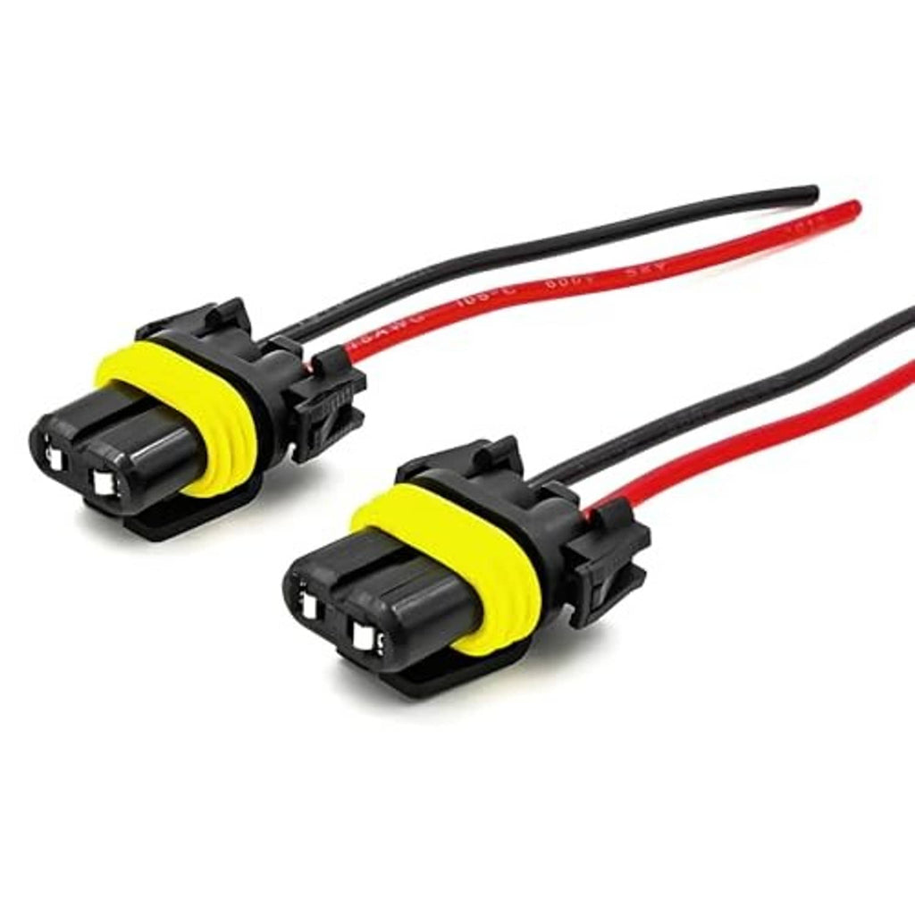 Two headlight wiring harness sockets with red/black wires and yellow gasket ring