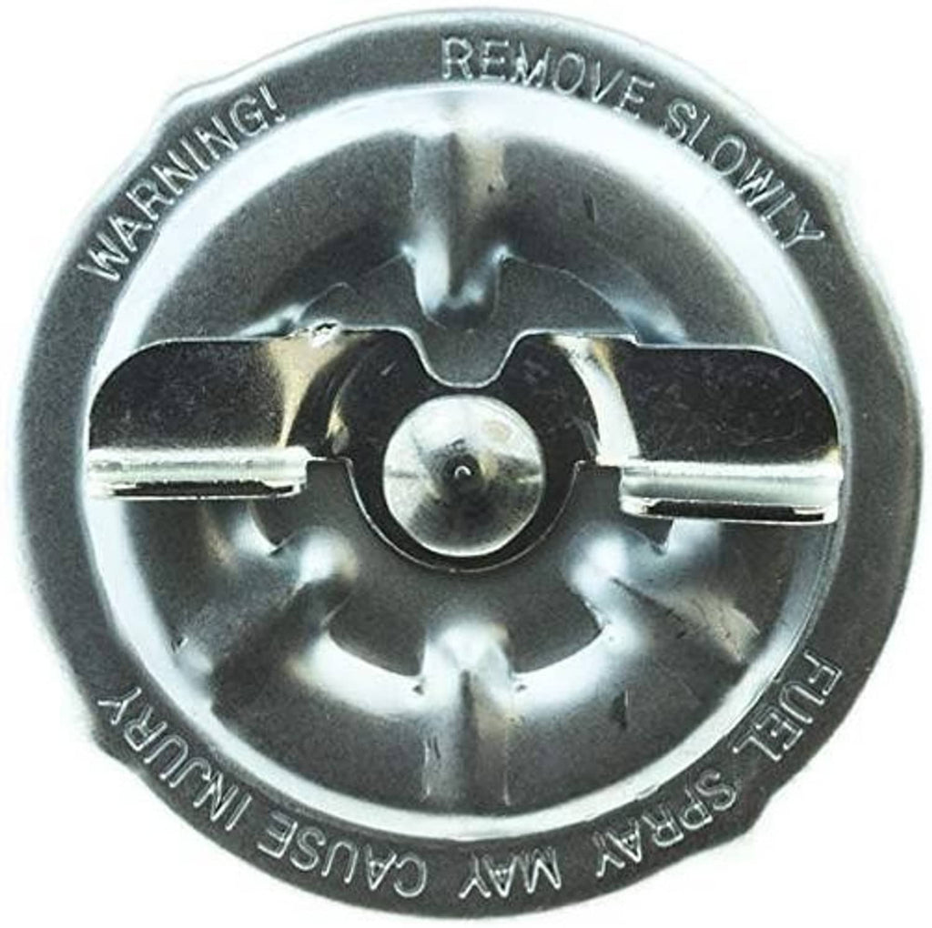 Fuel tank cap underside with tabs and stamped text “REMOVE SLOWLY” around edge