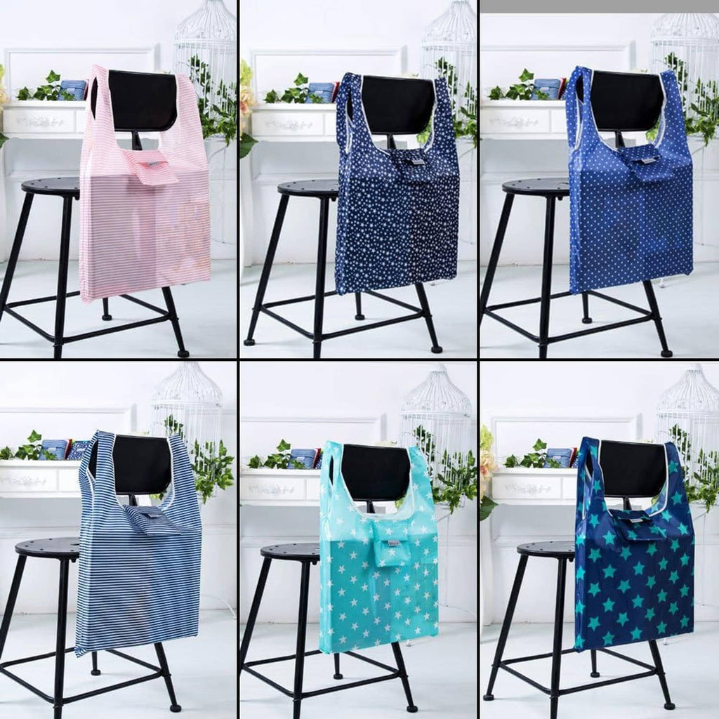 Foldable tote bags displayed on a chair: pink stripe, navy dot, striped, aqua star, and navy star