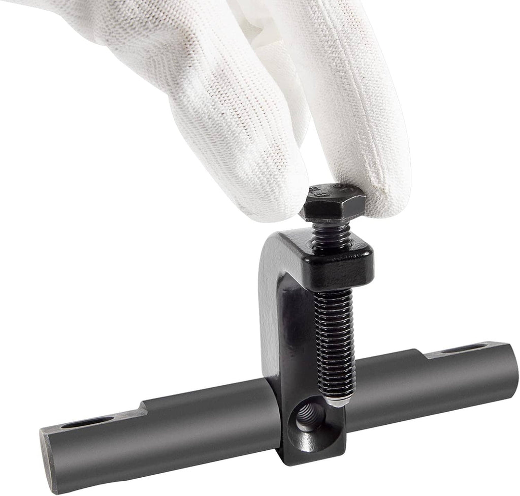 Black valve spring compressor tool clamped on a threaded rod with hex top