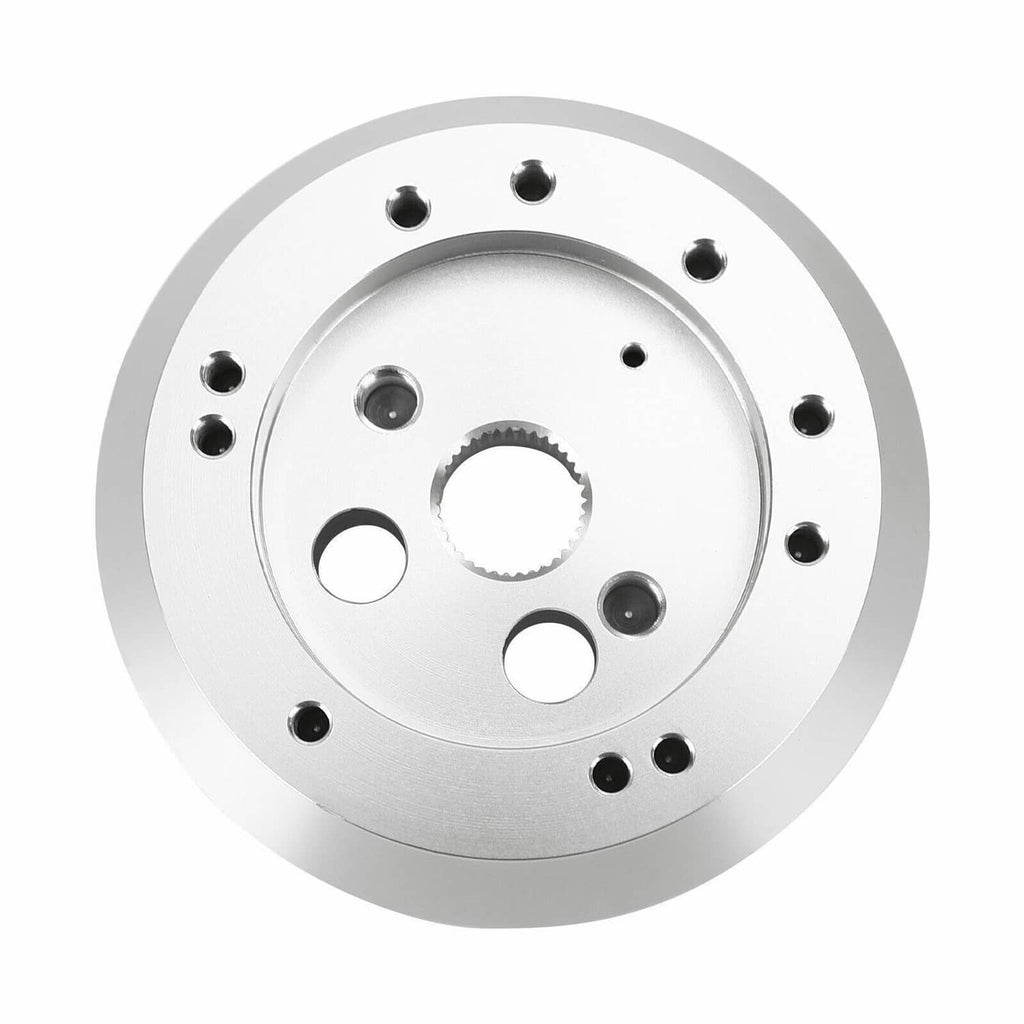 Polished steering wheel hub adapter faceplate with multiple bolt holes and center spline ring