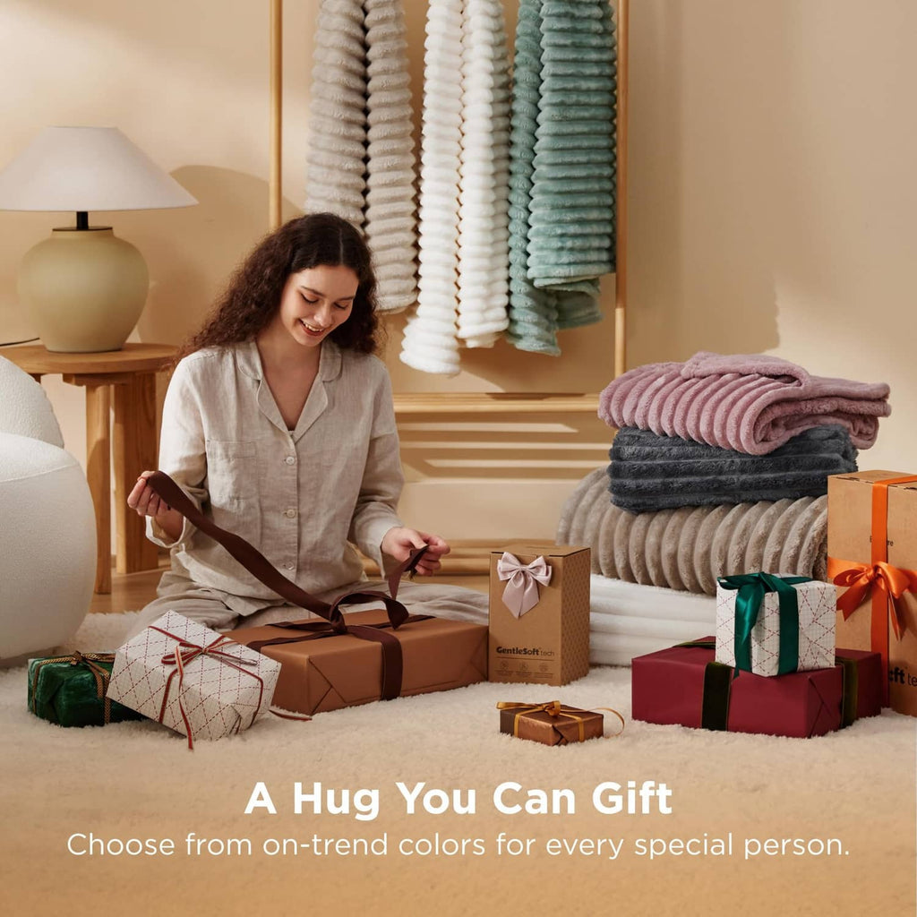 Folded off-white fleece blanket stack with gift presentation in a room