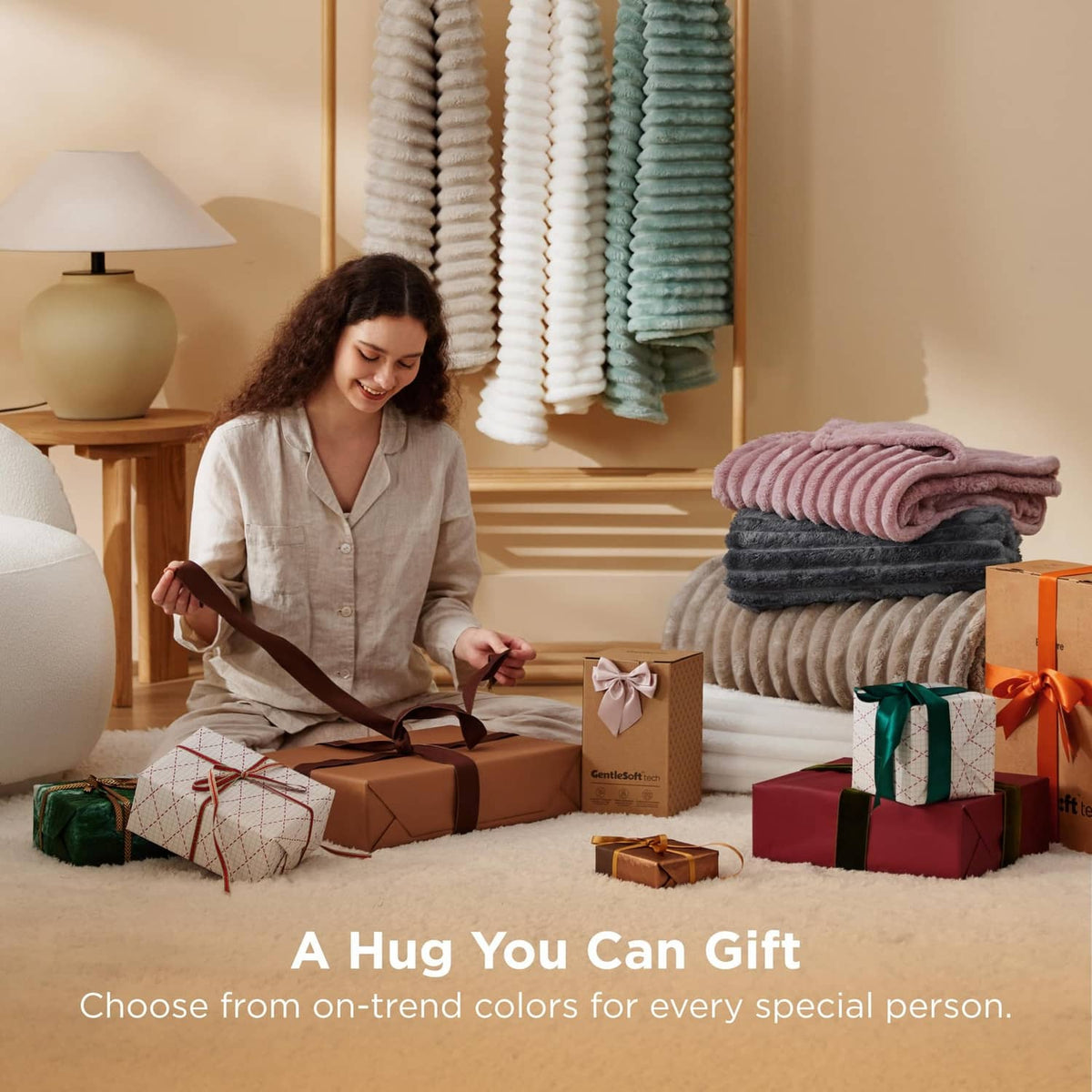 Folded off-white fleece blanket stack with gift presentation in a room