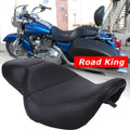 Black driver and passenger motorcycle seat with curved shape and stitched seams