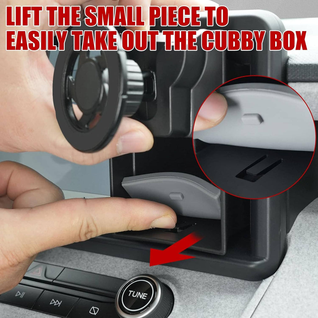 Magnetic phone holder cubby insert with hand lifting out the cubby box piece