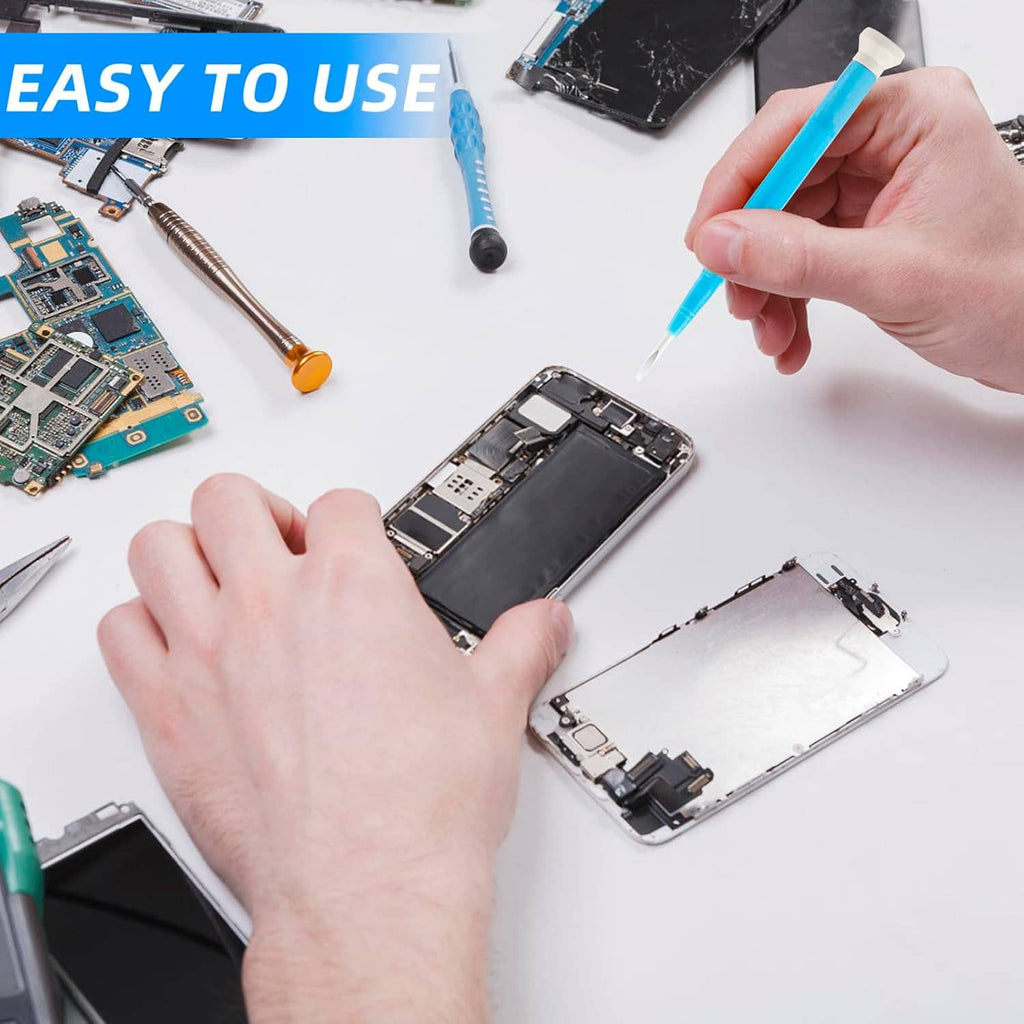 Hands using a blue slotted screwdriver on an electronics device
