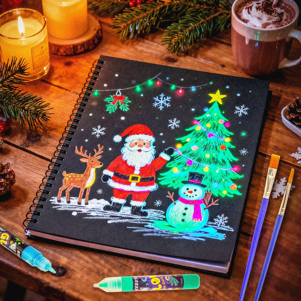Glow acrylic paint on a sketchbook page featuring a glowing Christmas tree and characters