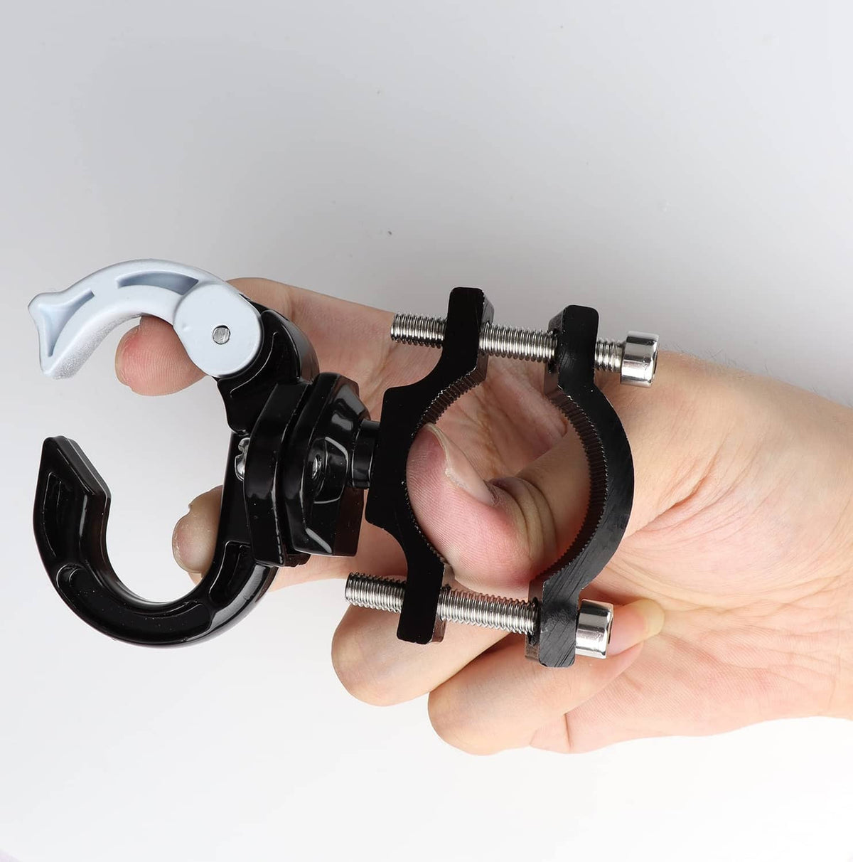 Electric scooter hanger hook being attached to a bar with adjustable screws, black and white